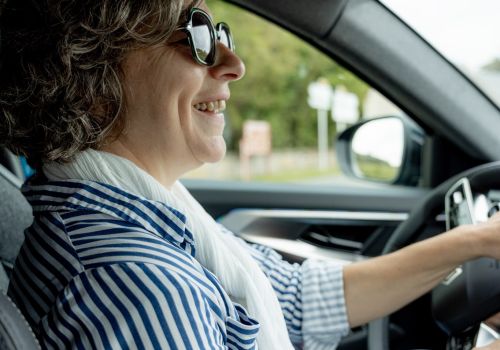 Professional guide driving guests in a comfortable vehicle through Normandy.